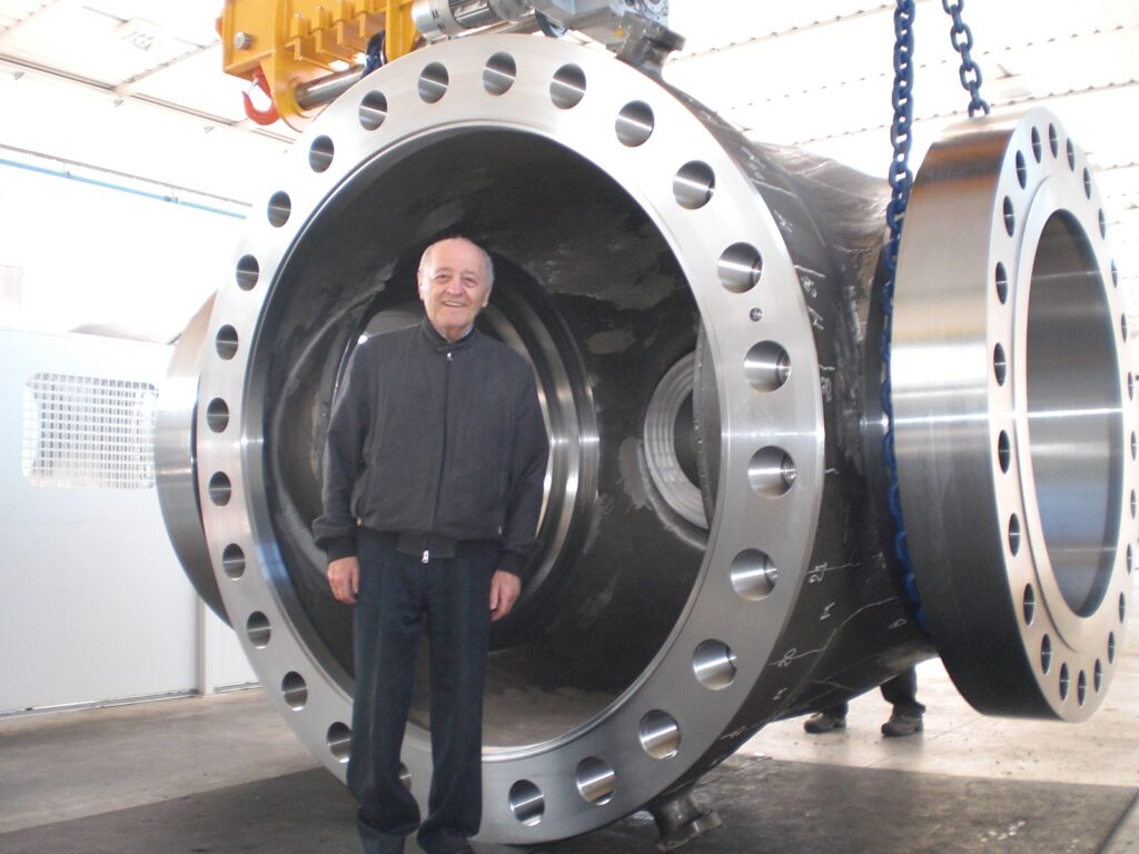 A large valve that was machined, in front of Mario, the founder of Trevisan Machine Tool